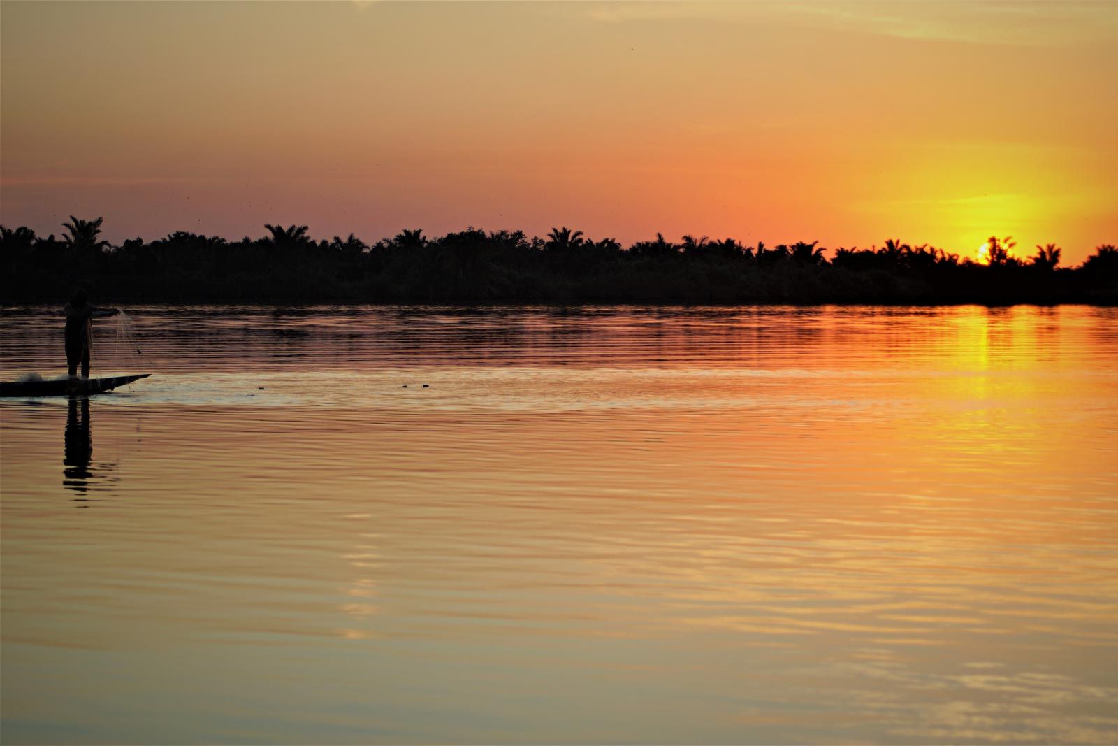 Fischer im Sonnenuntergang, Gambia River